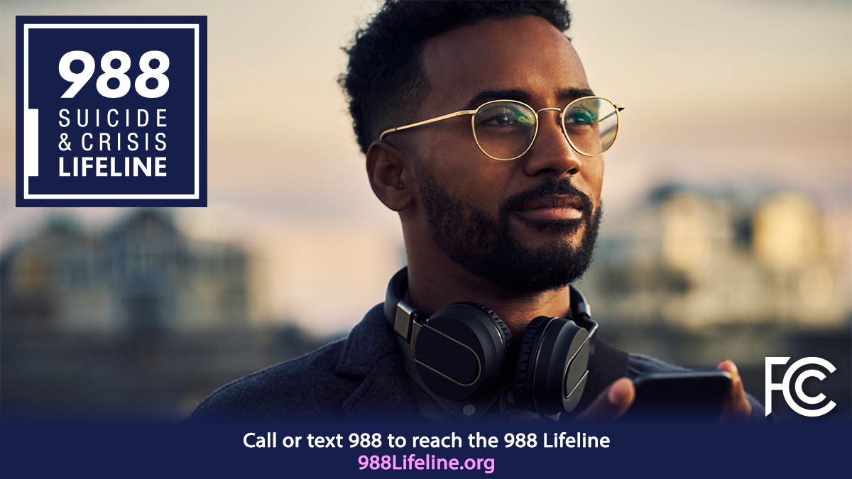 Man with headphones looking into the distance with text on the picture: 988 suicide & crisis lifeline and 988lifeline.org or text 988 to reach the 988 lifeline