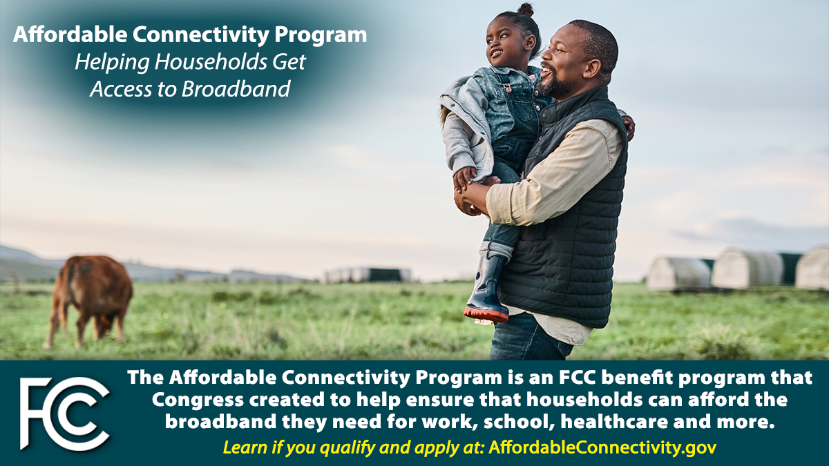 Affordable Connectivity Program. Father holding young daughter while standing in farm field