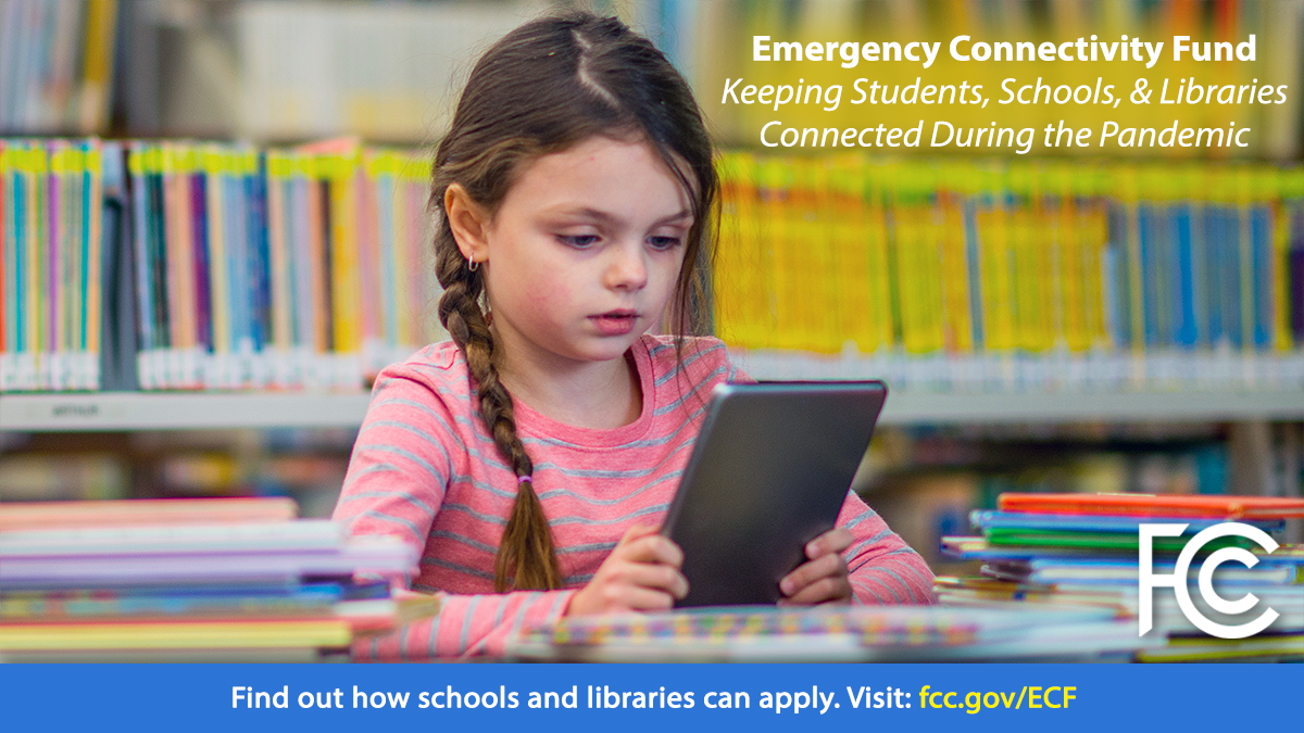 Emergency Connectivity Fund - girl with ponytail in library looking at a tablet computer