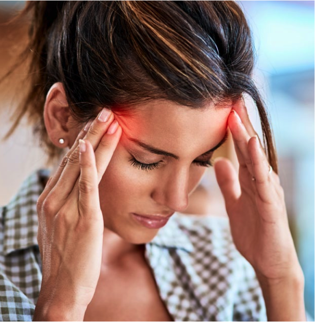 Lady appearing to have a headache